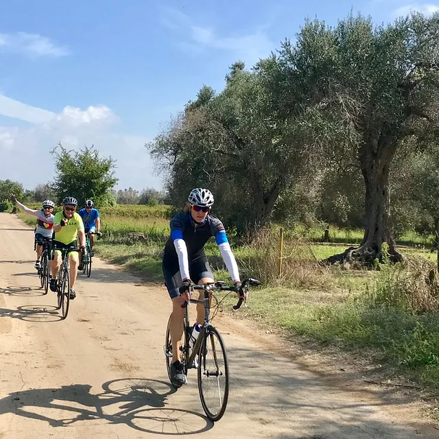 Tour Leader Suzie Cycling near Acaya